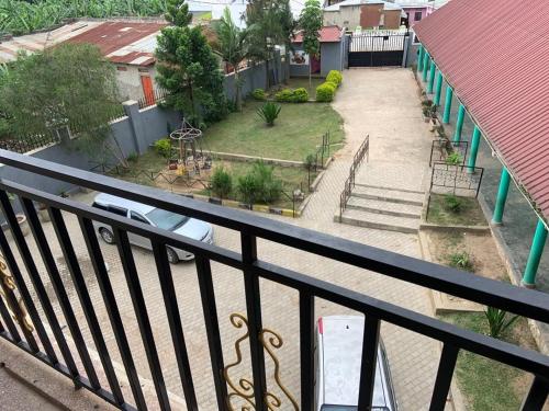 a balcony with a view of a yard with stairs at Jay Apartments in Mbarara