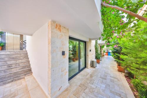 a hallway of a house with stairs and plants at Sole Vista Homes in Kas
