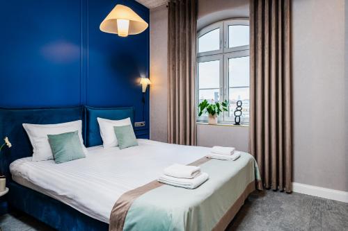 Кровать или кровати в номере Focus Premium Apartments by Focus Hotels