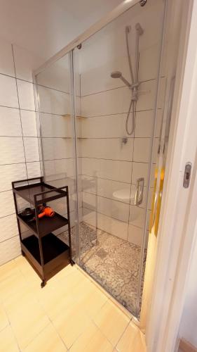 a shower with a glass door in a bathroom at Casa Prunilla in Sarno