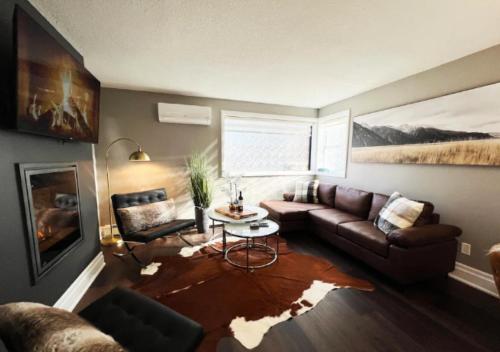 a living room with a couch and a table at Rustic Elegance & Style 1BR in London