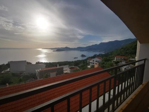 a view of the ocean from a balcony of a house at Villa Anlave in Sveti Stefan
