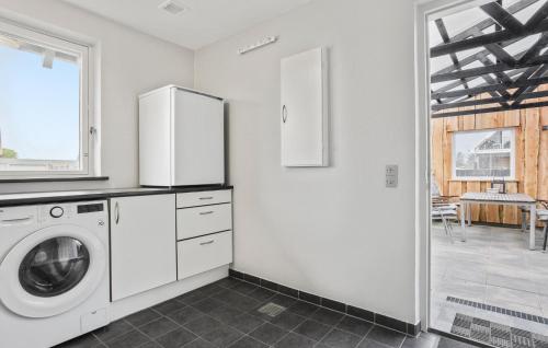 a white laundry room with a washer and dryer at Lovely Home In Vestervig With Wifi in Vestervig