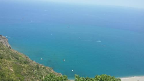 a view of the blue ocean from a hill at Borgo Marino casa vacanze in Santa Teresa di Riva