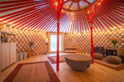 a room with a yurt with a table in it at Jurta pod Kriváňom in Vavrišovo