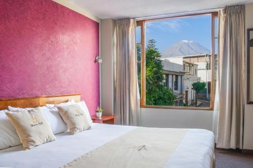 Ένα ή περισσότερα κρεβάτια σε δωμάτιο στο Hotel Maison Du Solei