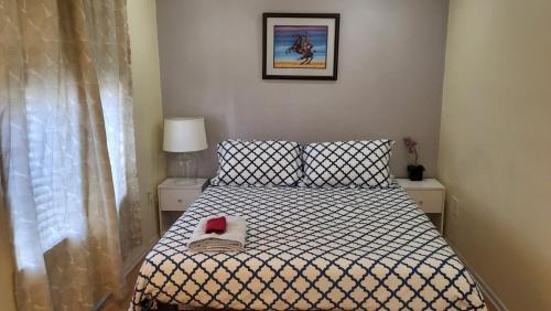 a bedroom with a bed with a black and white comforter at U4 - Cozy 1BR & 1BA Walkup APT in DT PHX with pkg in Phoenix