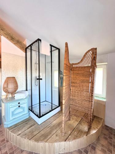 a room with a mirror and a chair and a table at H by Hambar in Vama Veche