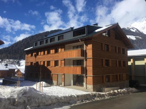a large building with snow on the ground at Venediger-Chalet in Matrei in Osttirol