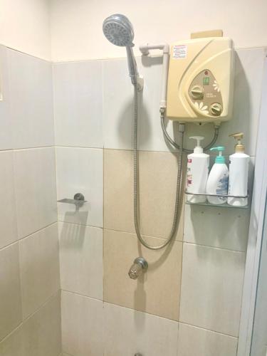 a shower in a bathroom with a shower head at Adayo Cove Resort in Siquijor