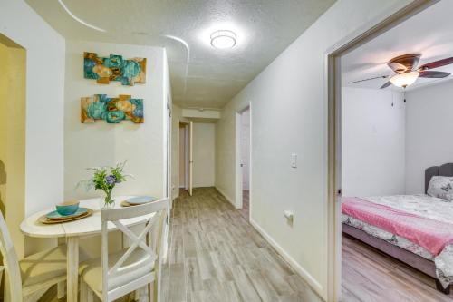 a bedroom with a bed and a table and a desk at El Centro Retreat Near Local Parks and Golf Courses in El Centro