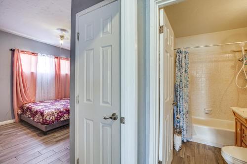 a door leading to a bedroom with a bed at Updated El Centro Home with Private Patio in El Centro