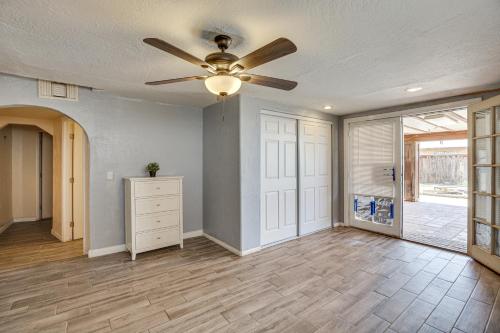 a living room with a ceiling fan and a dresser at Updated El Centro Home with Private Patio in El Centro