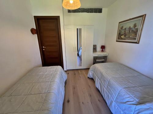 Ένα ή περισσότερα κρεβάτια σε δωμάτιο στο Casa del Mare - Oasi verde a soli 100m dal mare!
