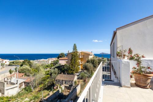 a view of the ocean from the balcony of a house at Sa Dommu e Mare in Santa Maria Navarrese