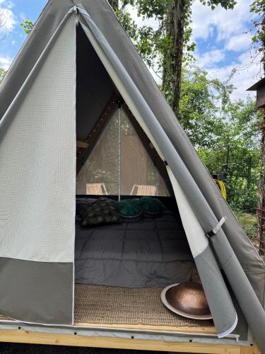 a tent with a bed inside of it at Palazzo delle Biscie - Old Tower & Village in Molinella