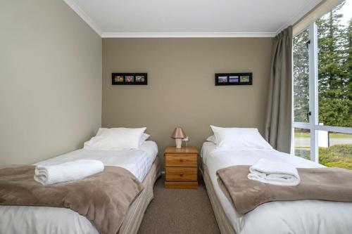 Ένα ή περισσότερα κρεβάτια σε δωμάτιο στο Peak Pad Methven Apartment