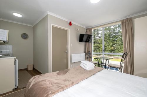 Ένα ή περισσότερα κρεβάτια σε δωμάτιο στο Peak Pad Methven Apartment