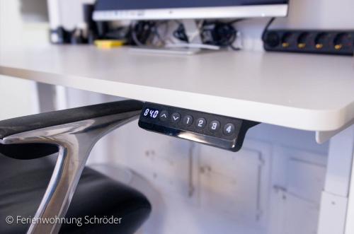 a computer monitor sitting on top of a desk at Ferienwohnung Schröder in Barntrup