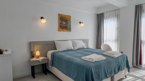 Un pat sau paturi într-o cameră la Emel Hanım butik otel&restoran