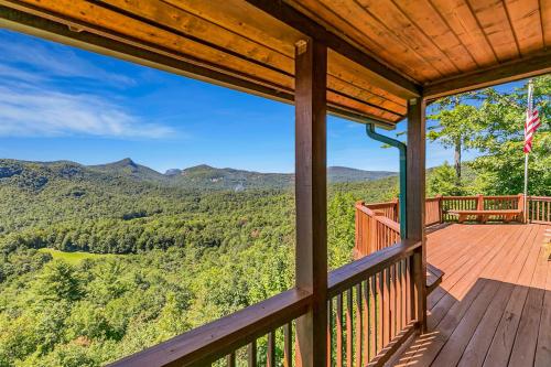 a deck with a view of the mountains at Mountain Views and Deck Stunning Sapphire Cabin in Sapphire