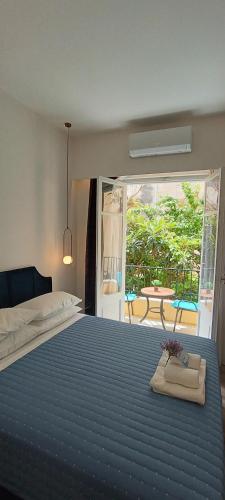 Ένα ή περισσότερα κρεβάτια σε δωμάτιο στο MUSES LUXURY SUITES