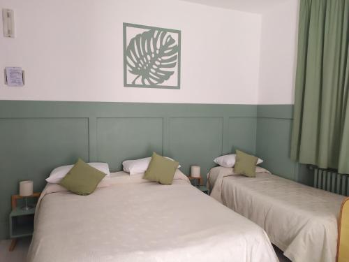 Postel nebo postele na pokoji v ubytování Albergo Mango