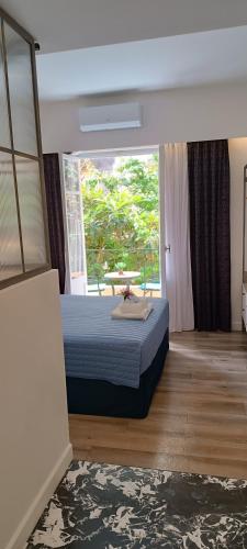 Ένα ή περισσότερα κρεβάτια σε δωμάτιο στο MUSES LUXURY SUITES