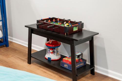a table with a chess board on top of it at Chicago Treasure 4 Bed Getaway in Chicago