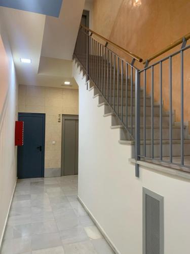 an empty hallway with stairs in a building at ARCO PLAZA DE ESPAÑA CADIZ in Cádiz