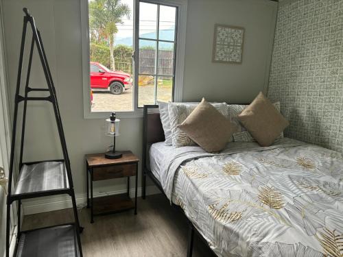 Ένα ή περισσότερα κρεβάτια σε δωμάτιο στο Gaspar Arenal Volcano