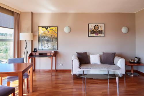 a living room with a couch and a table at Eurostars Don Cándido in Terrassa