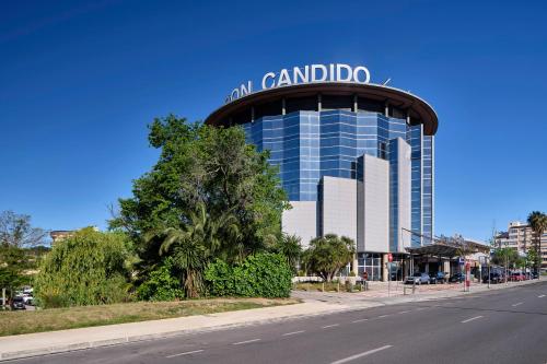 a tall building with a sign on top of it at Eurostars Don Cándido in Terrassa