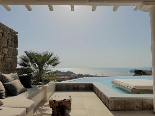 a villa with a view of the ocean at Nomia Sunset Suites Mykonos in Tagou