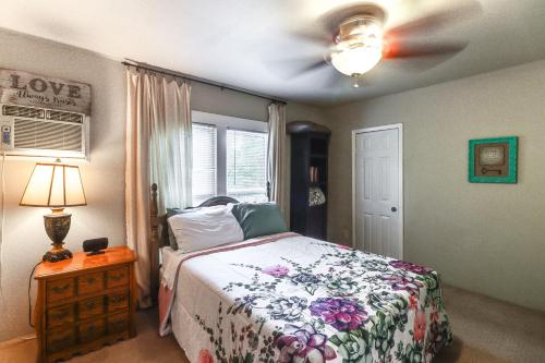 a bedroom with a bed and a ceiling fan at Harrison Family Home with Grill - Near Downtown! in Harrison