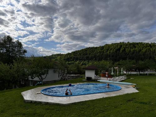 The swimming pool at or close to Guest House By The River