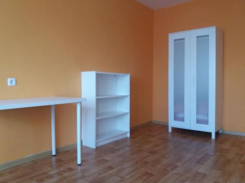 an empty room with a desk and a closet at Apartment in Pašilaičiai. Self check-in. Parking in Vilnius