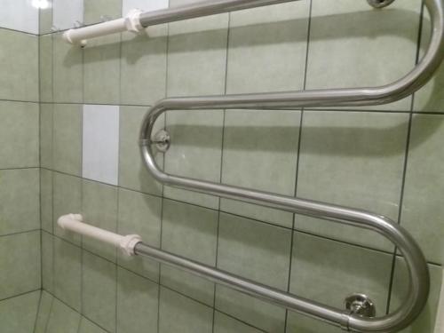 a bathroom with two hand rails on the wall at Apartment in Pašilaičiai. Self check-in. Parking in Vilnius