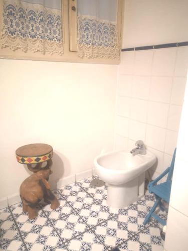 a bathroom with a toilet and a sink at B&B PARNASO in Torre Annunziata