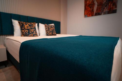 Ένα ή περισσότερα κρεβάτια σε δωμάτιο στο Sam Hotel