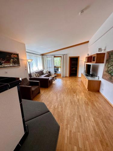 a living room with a couch and a table at AKTIV Apartments in Leutasch