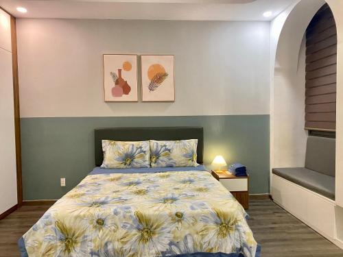 a bedroom with a bed with flowers on it at START HOUSE AIRPORT 5-MIN WALK Warm Stay, Easy Flight in Ho Chi Minh City