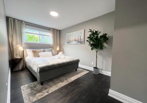 a bedroom with a bed and a potted plant at Elegant City Living - 1 BR in London