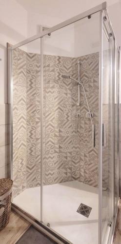 a shower with a glass enclosure in a bathroom at A casa di Alberta in Deiva Marina