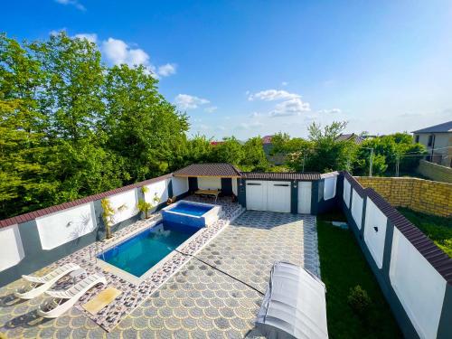 an overhead view of a backyard with a swimming pool at Qafqaz Milano Deluxe in Gabala