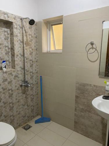 a bathroom with a shower and a toilet and a sink at Private room in Islamabad