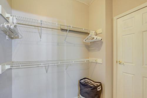 a bathroom with a toilet and a white door at Deck and Views Secluded Retreat in Fairview! in Fairview