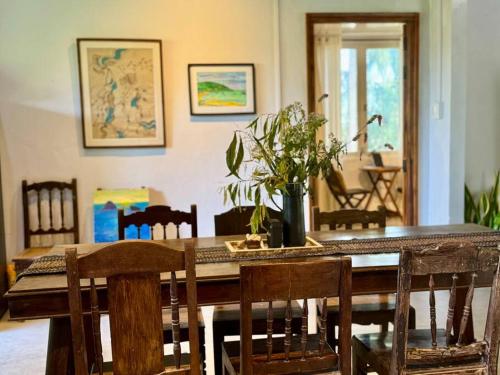 a dining room with a wooden table and chairs at Entire home and private beach in Phu Yen, Vietnam in Tuy An