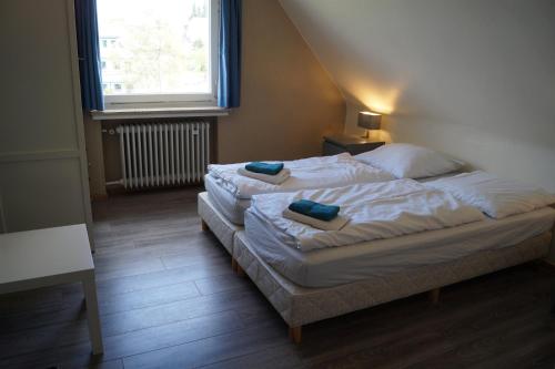 Ένα ή περισσότερα κρεβάτια σε δωμάτιο στο Hotel Pension De Gasterei