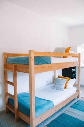 a pair of bunk beds in a room at Just Like Home - Casa Antonio em Paredes de Coura in Paredes de Coura